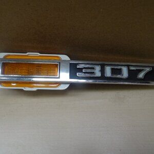 1968 Chevrolet Impala front fender 307 side marker light badge trim